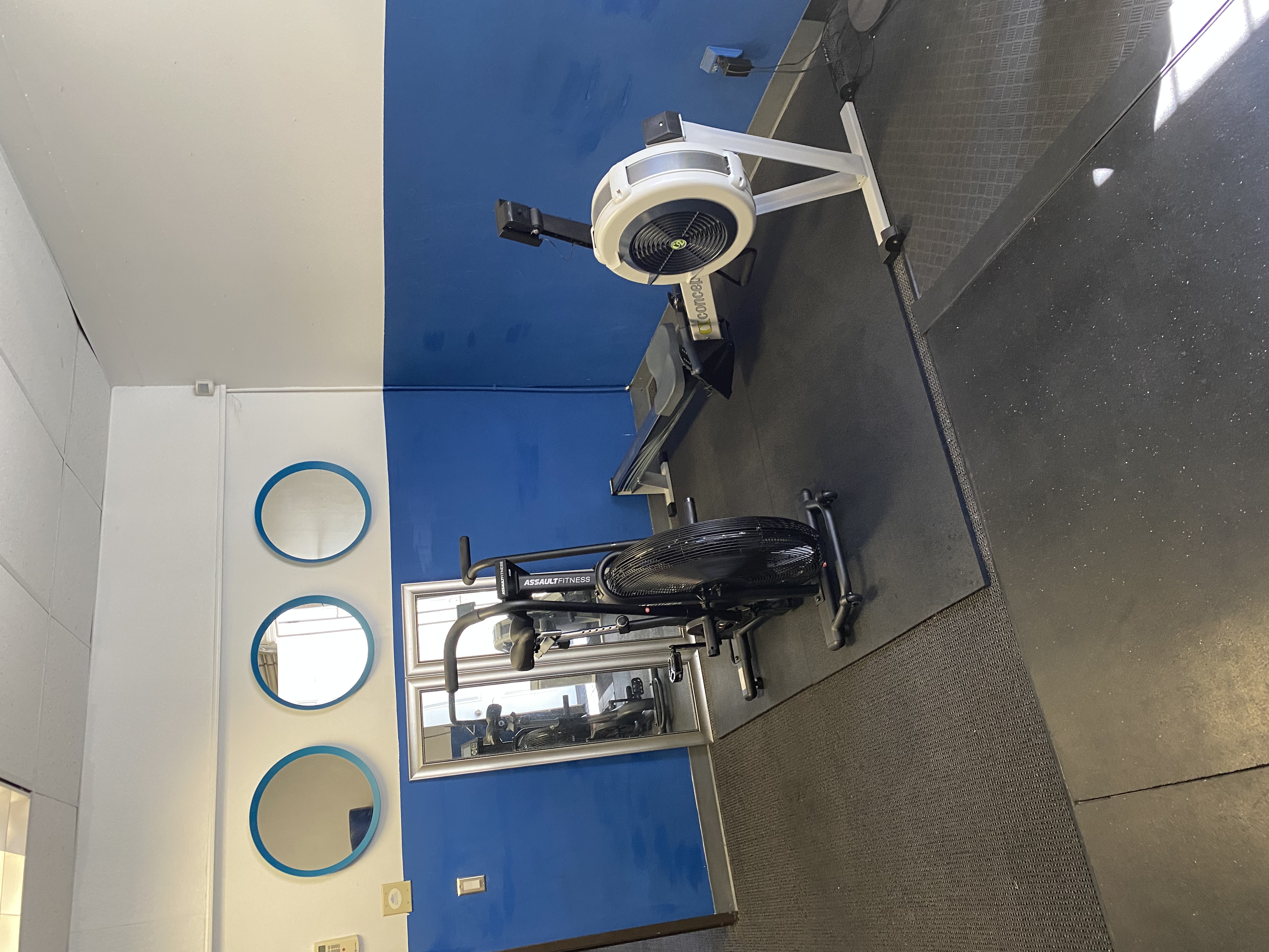 Air bike, rowing machine, and open training floor inside K2's Fremont studio